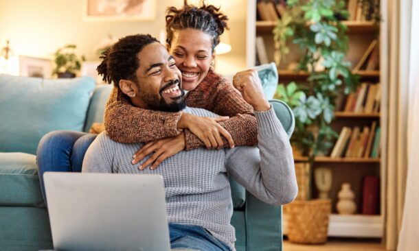 Young,Happy,Black,Couple,Having,Fun,Using,A,Laptop,At